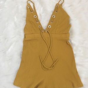 Fun, flirty,mustard colored romper 100% cotton.